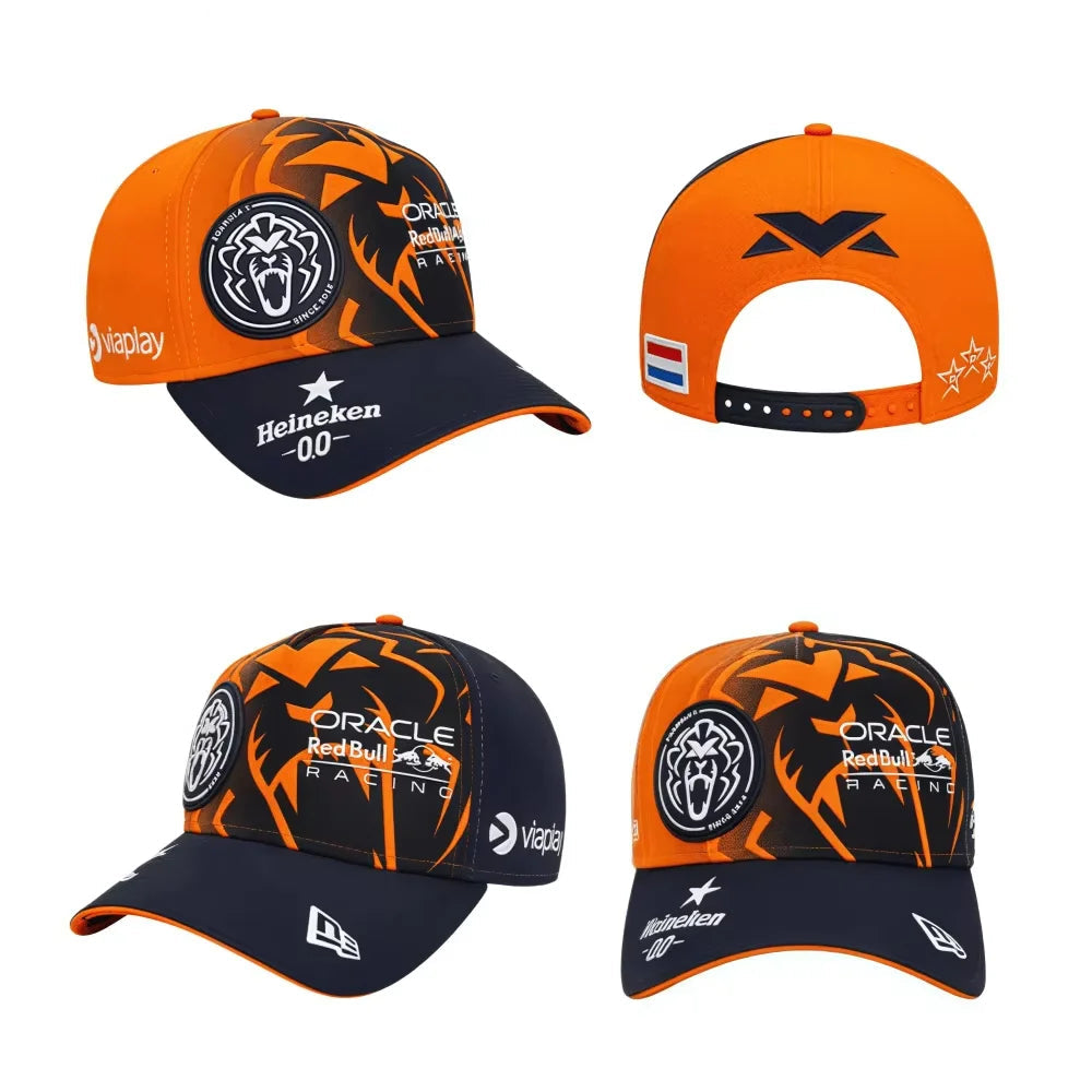 Four orange and black caps with various logos on a white background, featuring Red Bull branding.