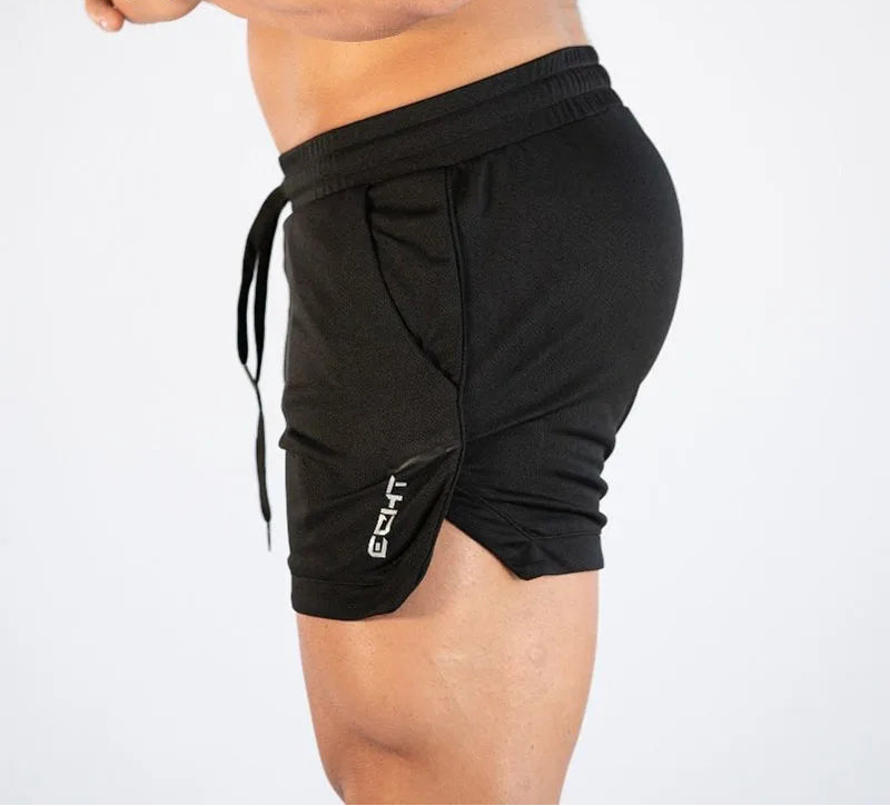 Black athletic shorts with a side drawstring and a vertical white 'GTF' logo on the lower leg, shown on a model from the side against a plain white background.